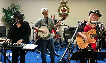 Joan plaing with band